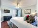 Cozy bedroom with large bed, ceiling fan, and flat screen tv on the wall at 419 Newton Pl, Longwood, FL 32779