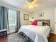 Bright bedroom featuring a large window, ceiling fan, and neutral decor at 419 Newton Pl, Longwood, FL 32779