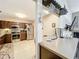 Modern kitchen with stainless steel appliances, dark wood cabinets, and an adjacent dining area at 419 Newton Pl, Longwood, FL 32779