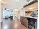 Open floor plan featuring kitchen with wine cooler, and bar, flowing into dining and Gathering rooms at 419 Newton Pl, Longwood, FL 32779