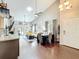 Open-concept living area with vaulted ceilings, fireplace, modern furnishings, and sliding door to a patio at 419 Newton Pl, Longwood, FL 32779