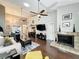 Bright living room boasting hardwood floors, a fireplace, and vaulted ceilings at 419 Newton Pl, Longwood, FL 32779