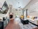 Sun-filled living room with vaulted ceilings, fireplace, and sliding glass doors to outdoor living area at 419 Newton Pl, Longwood, FL 32779