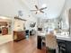 Bright open-concept living area featuring vaulted ceilings, a fireplace, and stylish modern decor at 419 Newton Pl, Longwood, FL 32779