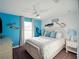 Bright bedroom with blue walls, white shiplap accent, and nautical decor to carry the aquatic theme at 4200 Oaktree Dr, Davenport, FL 33837