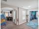 Inviting entryway featuring an ornate rug, decorative vase, views of an arcade room and bedroom for a grand impression at 4200 Oaktree Dr, Davenport, FL 33837