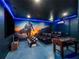 Modern game room featuring neon lighting, foosball table, and wall to wall tv setup at 4200 Oaktree Dr, Davenport, FL 33837