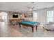 Bright game room featuring a pool table, bar seating, and a fun, inviting atmosphere at 4200 Oaktree Dr, Davenport, FL 33837