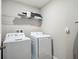 Functional laundry room with a stacked washer and dryer, providing convenience and space-saving design at 4200 Oaktree Dr, Davenport, FL 33837