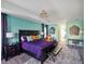 Spacious main bedroom with a king-sized bed, accent lighting, calming color palette, and a connected sitting area at 4200 Oaktree Dr, Davenport, FL 33837