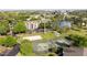 Aerial view of community featuring tennis and volleyball courts, lush landscaping, lake, and ample parking spaces at 4708 Walden Cir # 37, Orlando, FL 32811