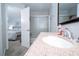 En-suite bathroom featuring a granite sink and shower with sliding glass doors at 4708 Walden Cir # 37, Orlando, FL 32811