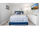Well-decorated bedroom with a patterned comforter and a mounted television at 4708 Walden Cir # 37, Orlando, FL 32811