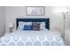 Comfortable bedroom featuring a beautifully patterned comforter and headboard at 4708 Walden Cir # 37, Orlando, FL 32811