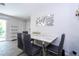 Contemporary dining room with a marble table and decorative mirror feature at 4708 Walden Cir # 37, Orlando, FL 32811