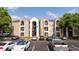 Inviting three-story apartment building with exterior staircase and ample parking at 4708 Walden Cir # 37, Orlando, FL 32811
