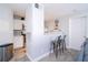 Bright kitchen view with stainless appliances, breakfast bar with seating, and white cabinets at 4708 Walden Cir # 37, Orlando, FL 32811
