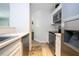 Open kitchen layout with stainless steel appliances and a modern countertop at 4708 Walden Cir # 37, Orlando, FL 32811
