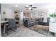 Open living room with a stylish leather sectional, dining area, and modern decor at 4708 Walden Cir # 37, Orlando, FL 32811
