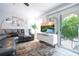 Living room showcasing a sectional couch, sliding glass door and modern decor at 4708 Walden Cir # 37, Orlando, FL 32811