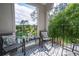 Scenic balcony offering outdoor seating with a tranquil water and green view at 4708 Walden Cir # 37, Orlando, FL 32811