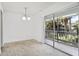 Balcony with glass sliding doors and view of palm trees and neighborhood at 4713 S Texas Ave # 4713D, Orlando, FL 32839