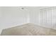 Carpeted bedroom with large closet, white walls, and one window at 4713 S Texas Ave # 4713D, Orlando, FL 32839
