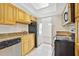 Traditional-style kitchen with stainless steel appliances and natural wood cabinets at 4713 S Texas Ave # 4713D, Orlando, FL 32839