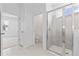 Bright bathroom featuring a glass enclosed shower, tile flooring, and neutral paint at 503 Silver Palm Dr, Haines City, FL 33844