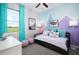 Bright bedroom with a scenic view, unique wall decor, and cozy furnishings, creating a comfortable retreat at 503 Silver Palm Dr, Haines City, FL 33844