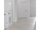 Bright hallway featuring recessed lighting, white doors, and neutral paint at 503 Silver Palm Dr, Haines City, FL 33844