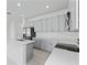 Open concept kitchen with stainless appliances, shaker cabinets, island and quartz countertops at 503 Silver Palm Dr, Haines City, FL 33844