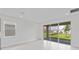 Bright living room with neutral walls, large sliding glass doors, and lots of natural light at 503 Silver Palm Dr, Haines City, FL 33844