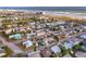 Aerial view of a neighborhood home with a pool, landscaped yard, close to the beach at 509 Eastwood Ln, Daytona Beach, FL 32118