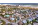 An aerial view of a vibrant coastal community with colorful homes near the beach and ocean at 509 Eastwood Ln, Daytona Beach, FL 32118