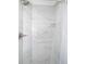 Bathroom shower featuring marble walls, a shower head, and a white shower curtain at 509 Eastwood Ln, Daytona Beach, FL 32118