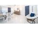 Bright dining area with tile floors, stylish decor, and a coastal beach house vibe at 509 Eastwood Ln, Daytona Beach, FL 32118