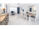 Bright dining area featuring tile floors, modern furniture, and stylish decor at 509 Eastwood Ln, Daytona Beach, FL 32118
