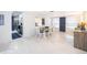 Bright dining area featuring tile floors, modern furniture, and stylish decor at 509 Eastwood Ln, Daytona Beach, FL 32118