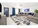 Inviting living room with stylish rug, comfortable sectional sofa, and nautical-themed decorations at 509 Eastwood Ln, Daytona Beach, FL 32118