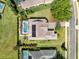 Aerial view of the property showcasing the pool, backyard, and the overall layout of the home at 5509 Meadow Hill Loop, Lady Lake, FL 32159