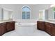 Luxurious bathroom featuring a soaking tub, elegant fixtures, and and vanity at 5509 Meadow Hill Loop, Lady Lake, FL 32159