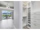 Well-organized walk-in closet with custom shelving and drawers, providing ample storage space at 5509 Meadow Hill Loop, Lady Lake, FL 32159