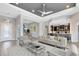 Open-concept living room with modern furnishings and access to the dining area and kitchen at 5509 Meadow Hill Loop, Lady Lake, FL 32159