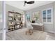 Bright office space with shutters, a desk, shelves, and wood-look floors for an inspiring work environment at 5509 Meadow Hill Loop, Lady Lake, FL 32159