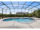 Beautiful backyard oasis with a sparkling blue pool and relaxing hot tub surrounded by lush landscaping at 5509 Meadow Hill Loop, Lady Lake, FL 32159