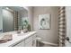 Bathroom featuring a modern vanity, decorative art, and a shower with a patterned curtain at 557 Moon Shell Cir, New Smyrna Beach, FL 32168