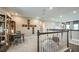 Versatile loft space with a desk, shelving, and comfortable seating area at 557 Moon Shell Cir, New Smyrna Beach, FL 32168