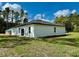 The backyard features a lush lawn and an expansive view of the surrounding greenery at 6872 Sw 132Nd Pl, Ocala, FL 34473