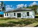 A spacious backyard featuring lush green grass, with ample room for outdoor activities at 6872 Sw 132Nd Pl, Ocala, FL 34473